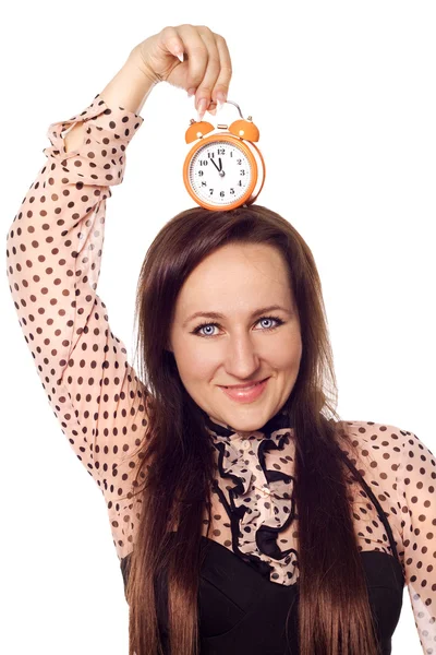 Mujer joven sosteniendo un reloj en su cabeza Fotos De Stock