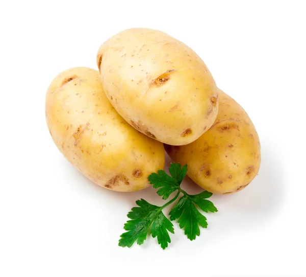 Drei neue Kartoffeln mit Petersilienblatt isoliert auf weißem Hintergrund Nahaufnahme lizenzfreie Stockbilder