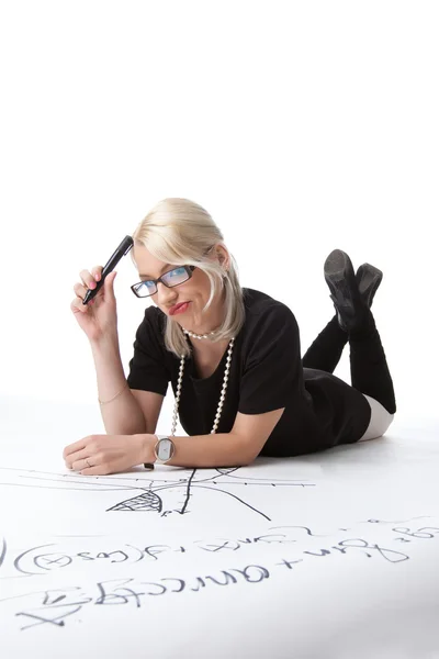 Cute blond woman thinking on graph — Stock Photo, Image