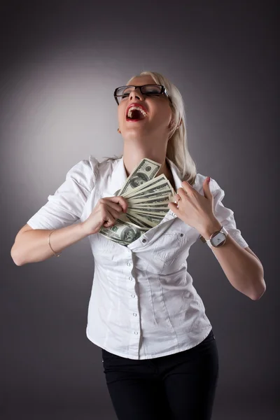 Blond businesswoman hide money under shirt — Stock Photo, Image