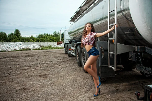 Sexy young woman and truck — Stock Photo, Image
