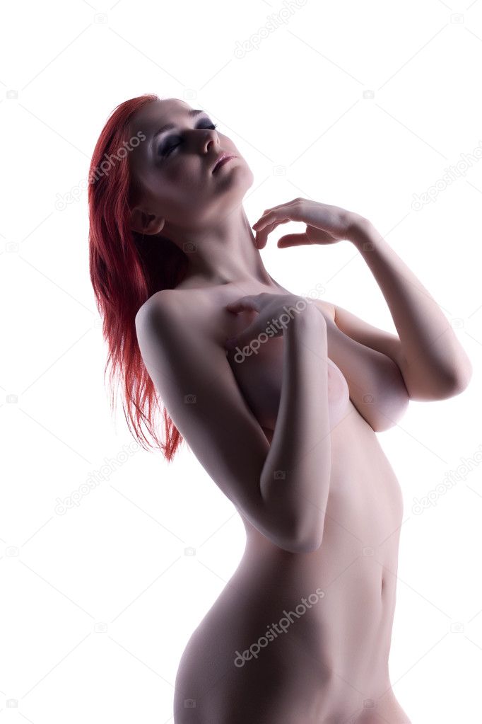 Nude young woman with red hair