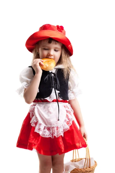 Красная Шапочка ест торт — стоковое фото