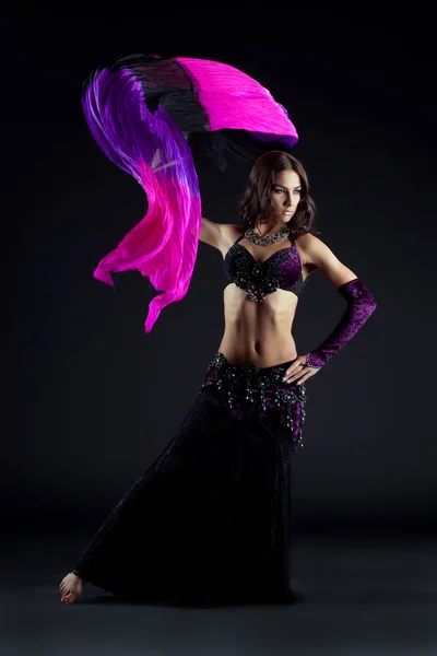 Pretty young woman dancing oriental dance — Stock Photo, Image