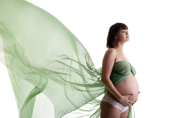 Mulher grávida bonita com tecido de sopro — Fotografia de Stock
