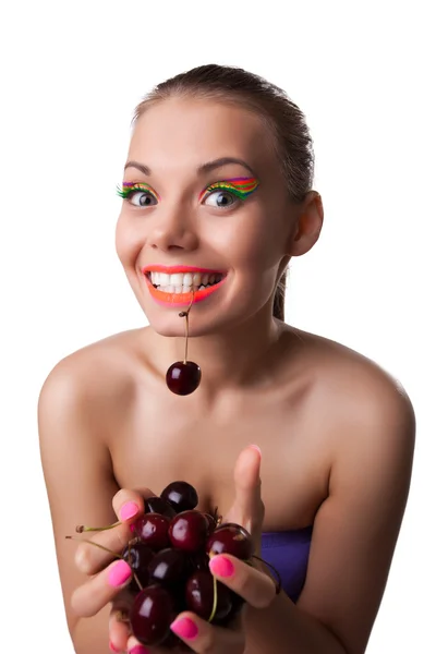 Smile funny woman eat one of two ripe cherry — Stock Photo, Image