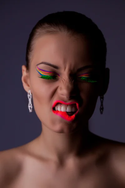 Beauty and anger woman portrait with uv cosmetics — Stock Photo, Image