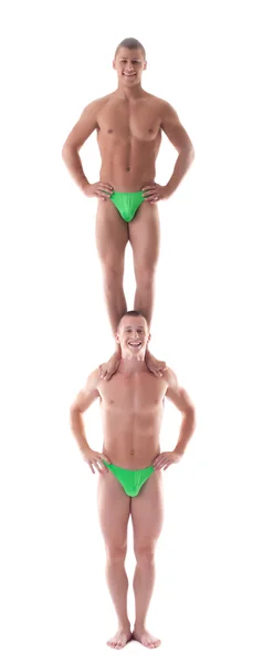 Två män gymnast stå en på andra — Stockfoto