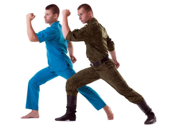 Två atletiska man poserar i armén kostym isolerade — Stockfoto