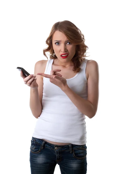 Anger Young woman point on cell phone — Stock Photo, Image