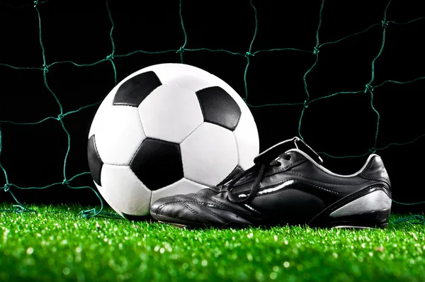 Bola de fútbol y tacos — Foto de Stock