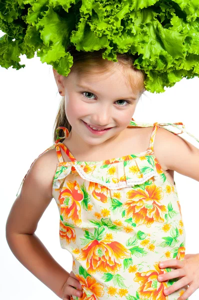Little sweet girl with a salad on her head — Stock Photo, Image