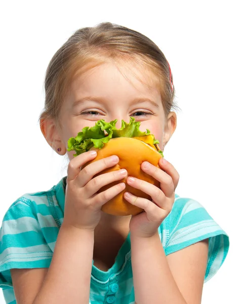 Liten flicka äter en smörgås som isolerade — Stockfoto