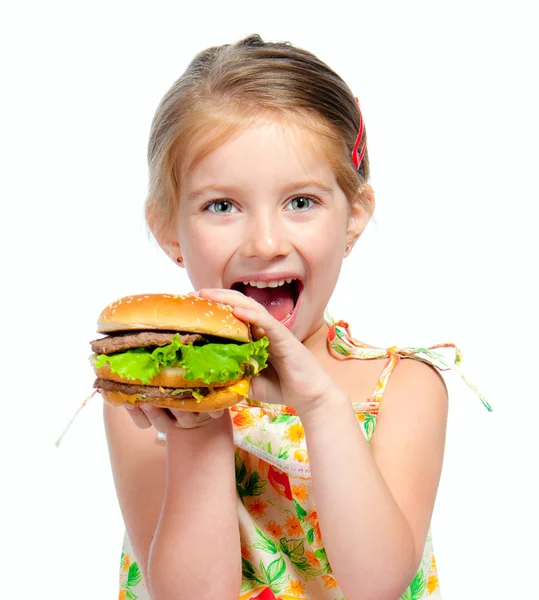 Klein meisje eten een broodje geïsoleerd — Stockfoto