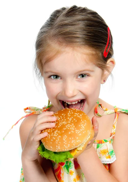 Klein meisje eten een broodje geïsoleerd — Stockfoto