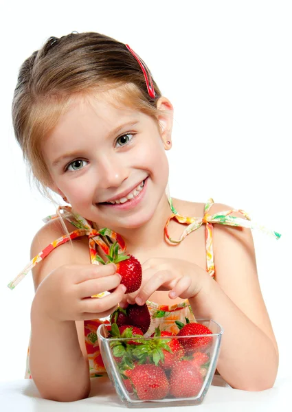 Little cute girl holding a strawberry — Stock Photo, Image