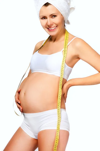 Mulher grávida mede o estômago — Fotografia de Stock