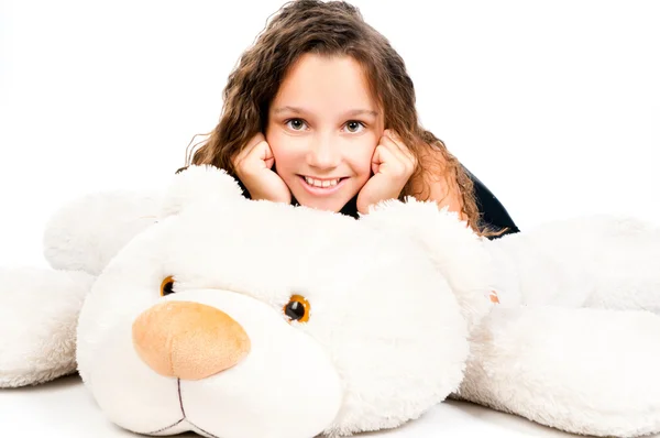 Beautiful little girl with toy bear — Stock Photo, Image