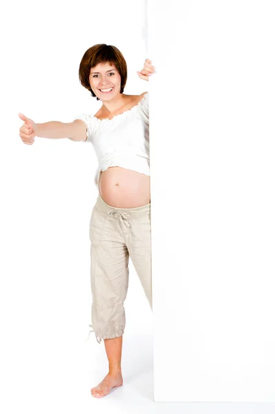Terhes nő, egy fehér tábla — Stock Fotó