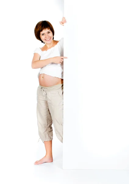 Mulher grávida com um quadro branco — Fotografia de Stock