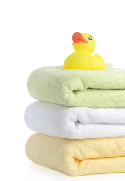 Bath accessories. Bath towels and Yellow rubber duckies — Stock Photo, Image