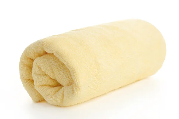 Rolled up yellow beach towel — Stock Photo, Image