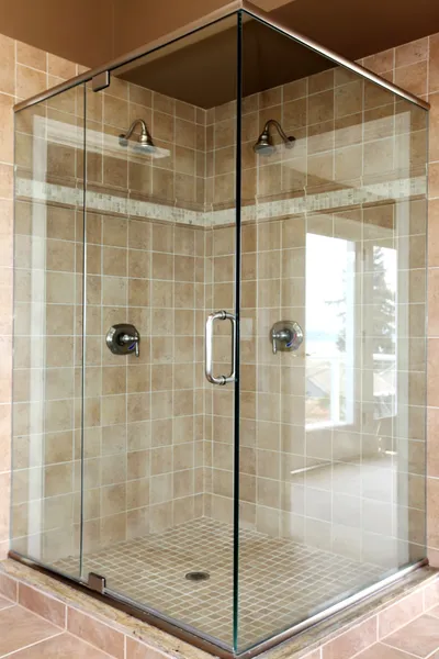 Modern new glass walk in shower with beige tiles. — Stock Photo, Image