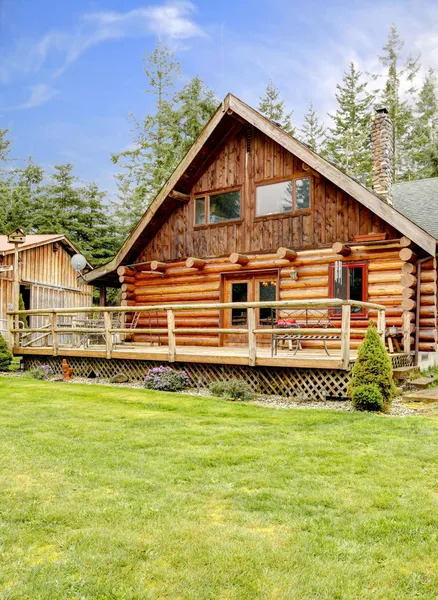 Rustic log small cabin deck exterior. — Stock Photo, Image