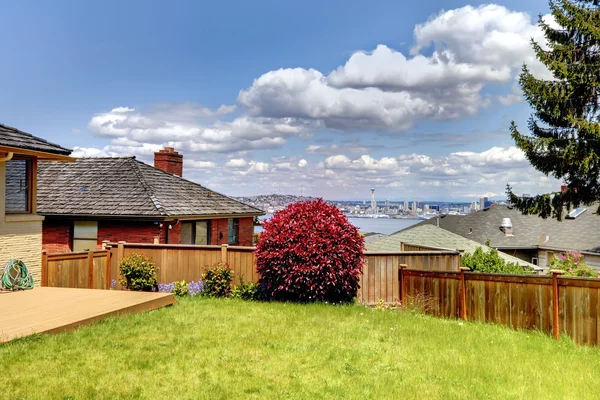 Back yard with fence and view of Seattle Space Niddle. — Stock Photo, Image