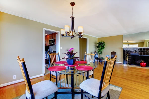 Dining room with round table and fireplace. — Stock Photo, Image