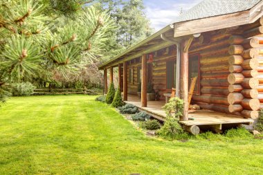 Front porch of old log cabin. clipart