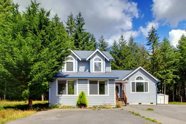 stock image Small grey American house near the forest.