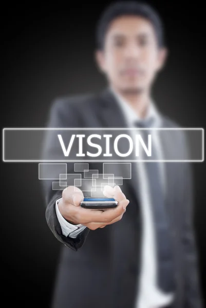 Affärsman håller vision word från mobiltelefon. — Stockfoto