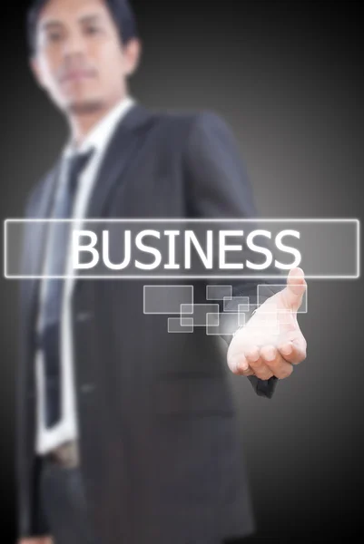 Бизнесмен держит деловое слово на доске . — стоковое фото