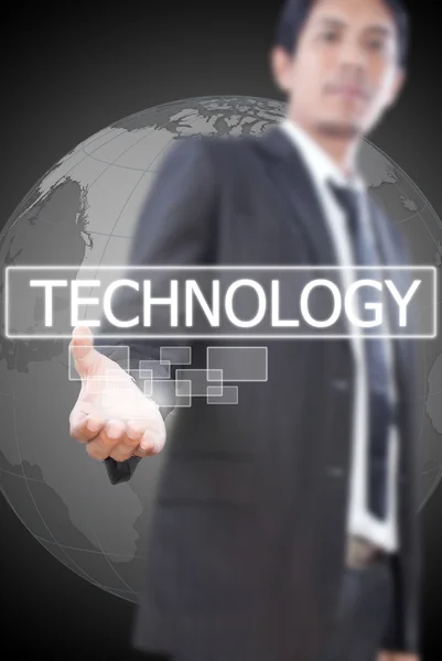Biznesmen posiadania słowo technologia na tablicy. — Zdjęcie stockowe