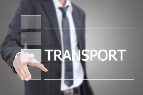 Businessman pushing Transport word on a touch screen interface. — Stock Photo, Image