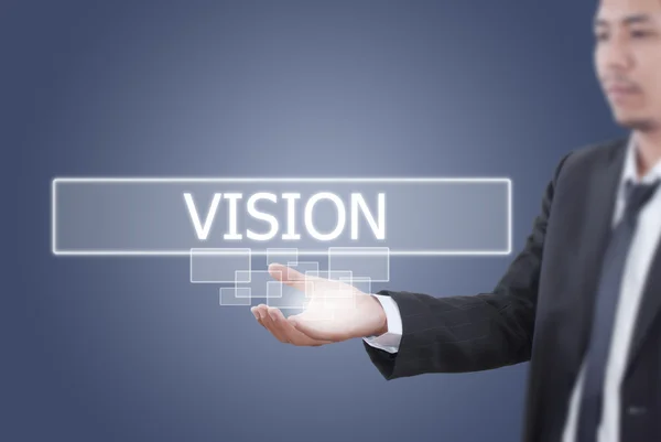 Businessman holding Vision word on the whiteboard. — Stock Photo, Image