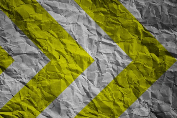 Yellow and black warning sign on paper texture — Stock Photo, Image