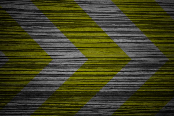 Segnale di avvertimento giallo e nero su texture in legno — Foto Stock
