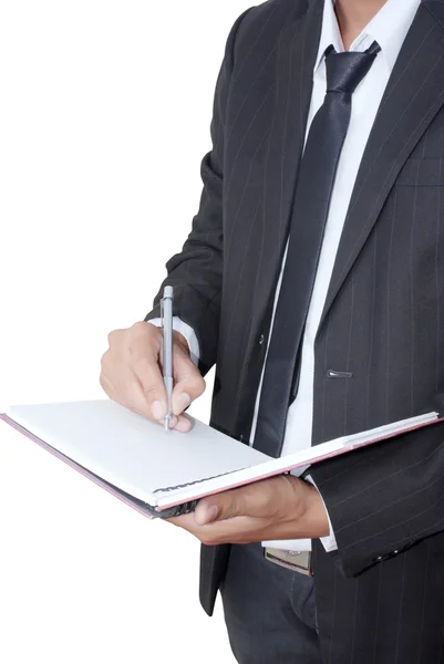 Empresário asiático escrevendo no notebook — Fotografia de Stock