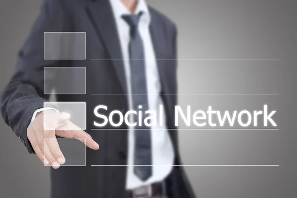 Azjatycki biznesmen przesuwając słowo sieć społeczną na interfejs ekranu dotykowego — Zdjęcie stockowe