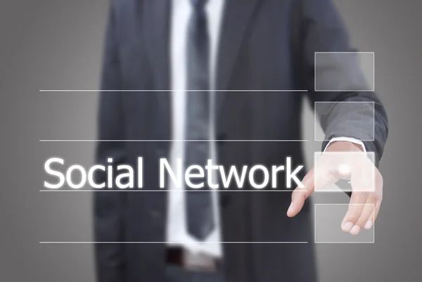 Azjatycki biznesmen przesuwając słowo sieć społeczną na interfejs ekranu dotykowego — Zdjęcie stockowe