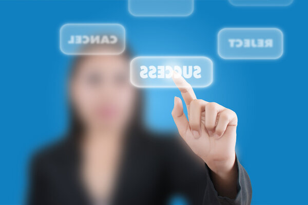 Business woman pushing success word