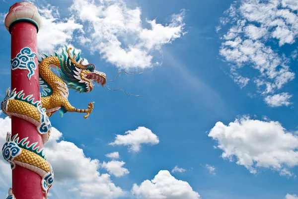 Dragon statue with the blue sky field. Royalty Free Stock Photos