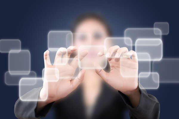 Asian woman pushing digital button on the whiteboard.