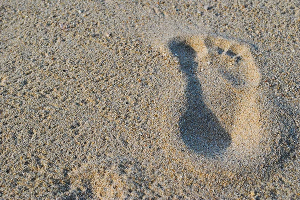 Foot on sand texture background — Stock Photo, Image
