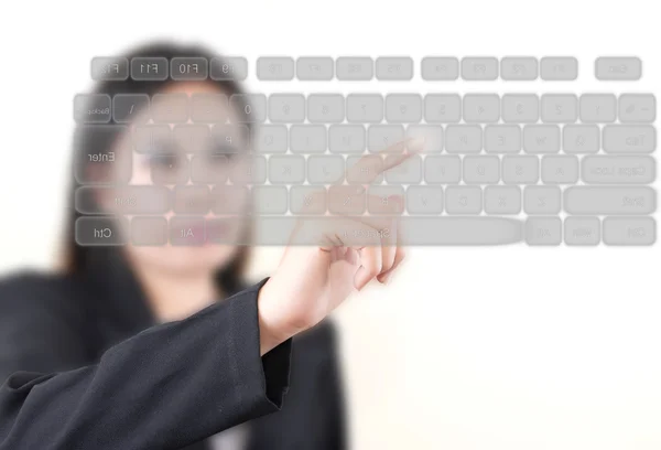 Asian business lady pushing transparent keyboard on the whiteboard — Stock Photo, Image