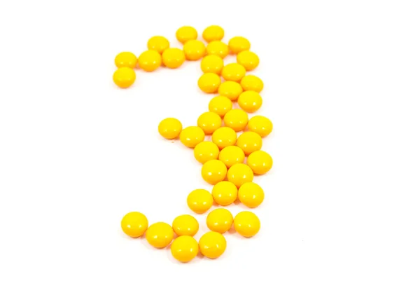 Birçok sarı ilaç izole üzerinde beyaz — Stok fotoğraf
