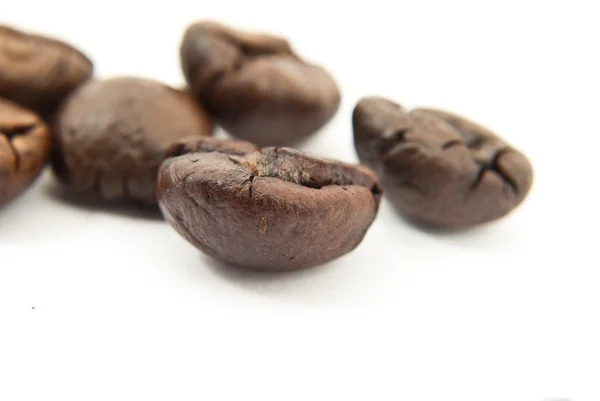 stock image Close up fresh coffee beans isolated on the white.