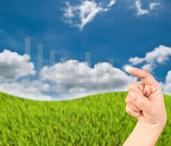 Hans pressing up graph on the blue sky field. — Stock Photo, Image